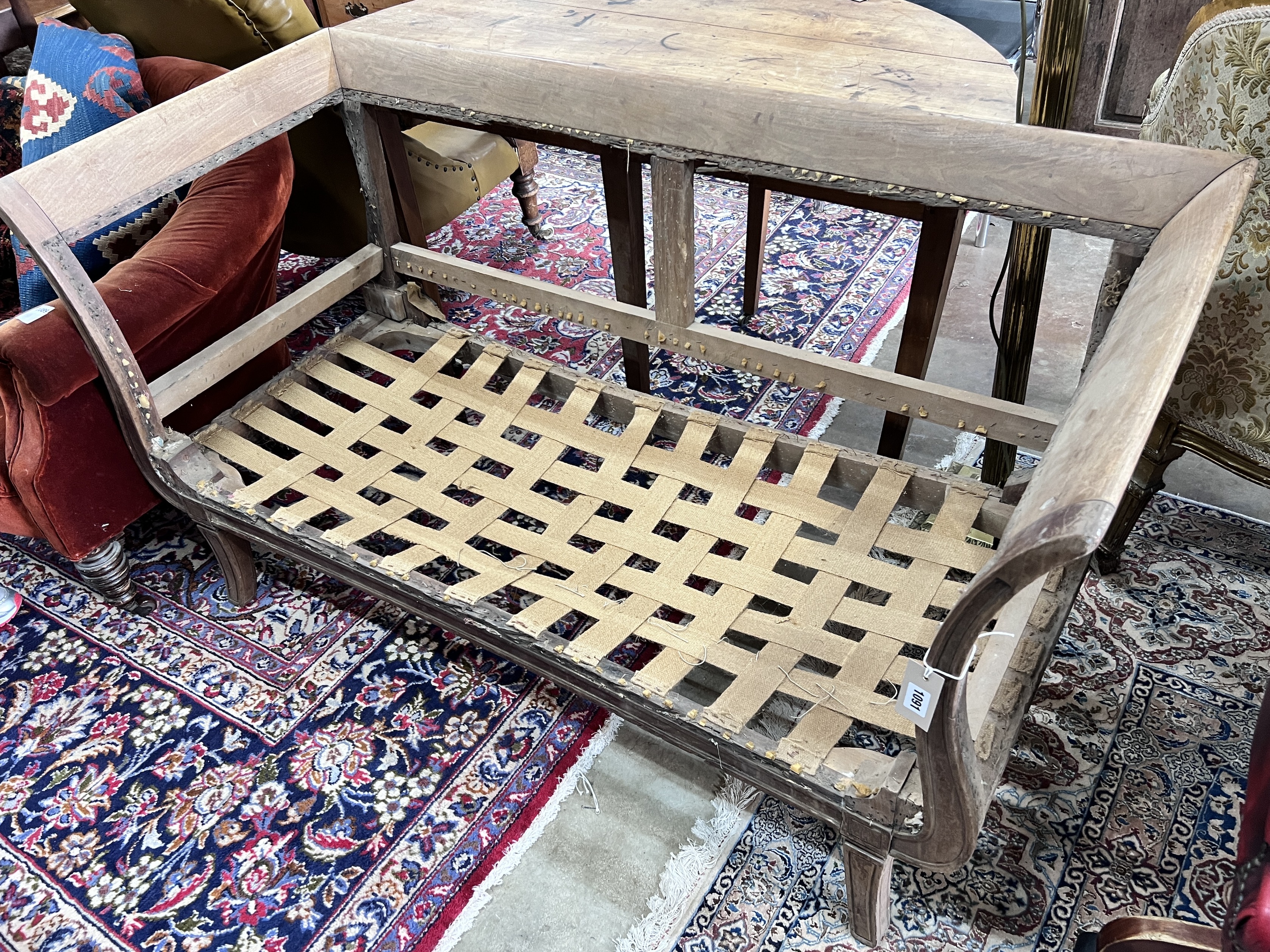 A Regency mahogany settee frame, length 144cm, width 67cm, height 77cm